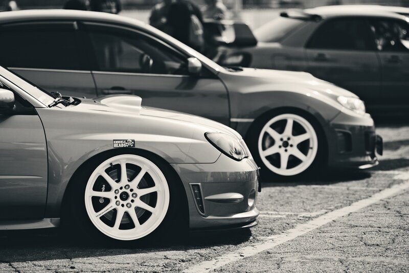 Custom cars in a parking lot