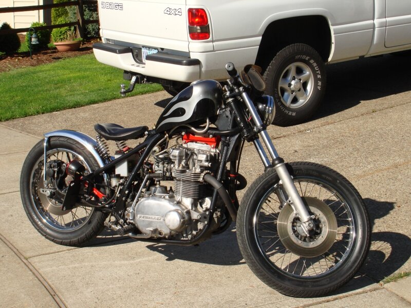 Custom Chopper Motorcycle — Black, Calm, Afternoon, Photograph, White Truck