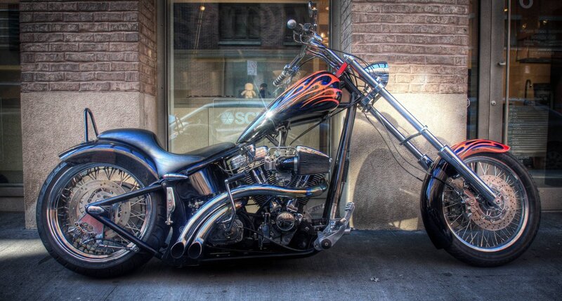 Custom Chopper Motorcycle — Black, Dramatic, Afternoon, Photograph, Brick Building, Store Window