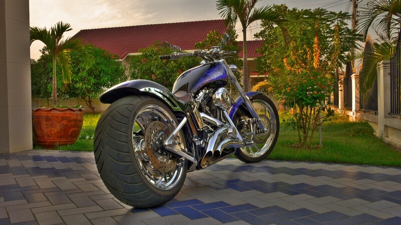 Custom chopper motorcycle in driveway
