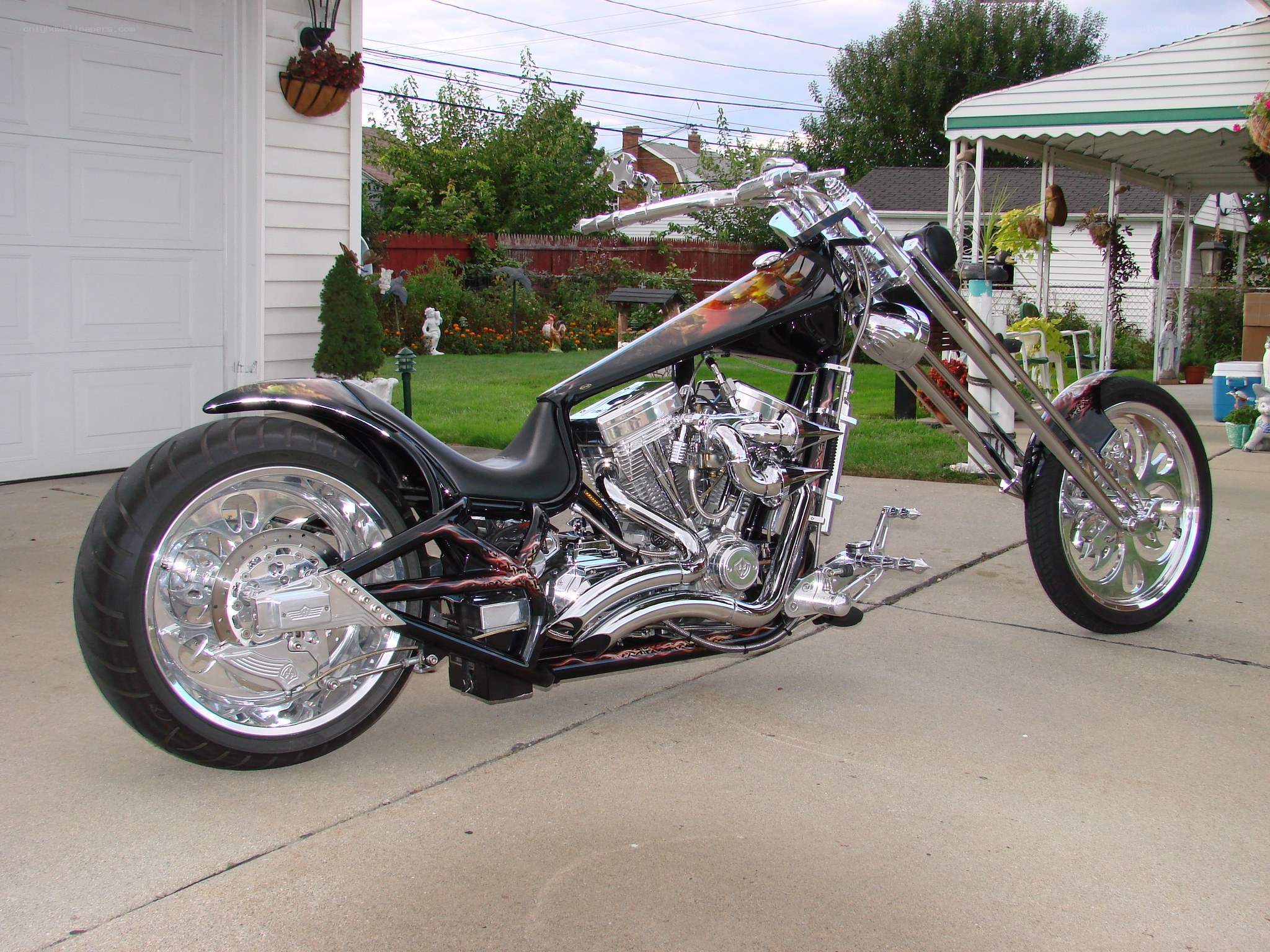 custom chopper motorcycle in driveway
