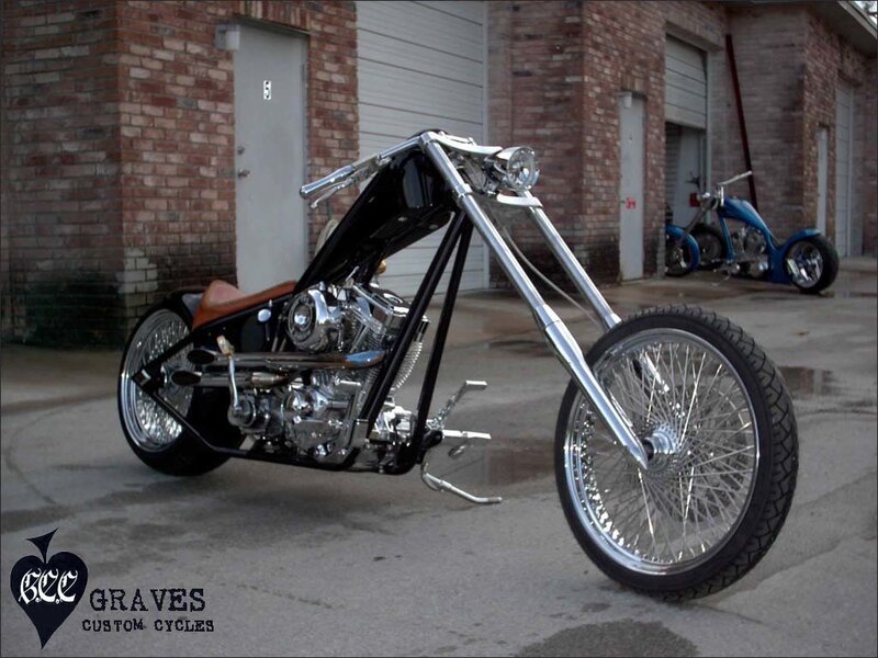 Custom chopper motorcycle in front of garage