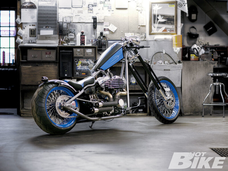 Custom chopper motorcycle in workshop