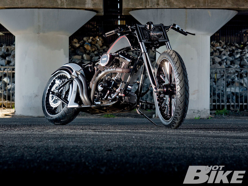 custom chopper motorcycle under bridge