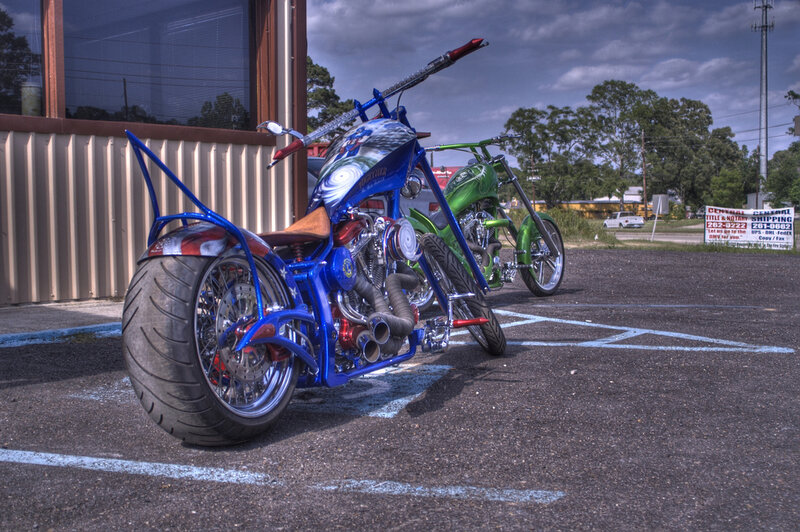 Custom chopper motorcycles in parking lot