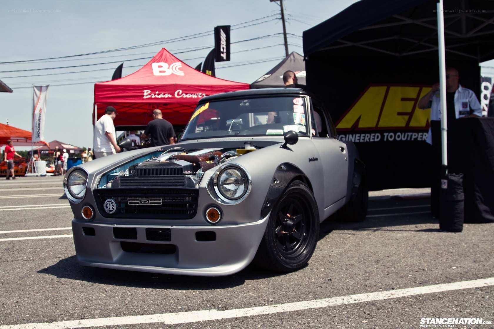 custom gray datsun car at show