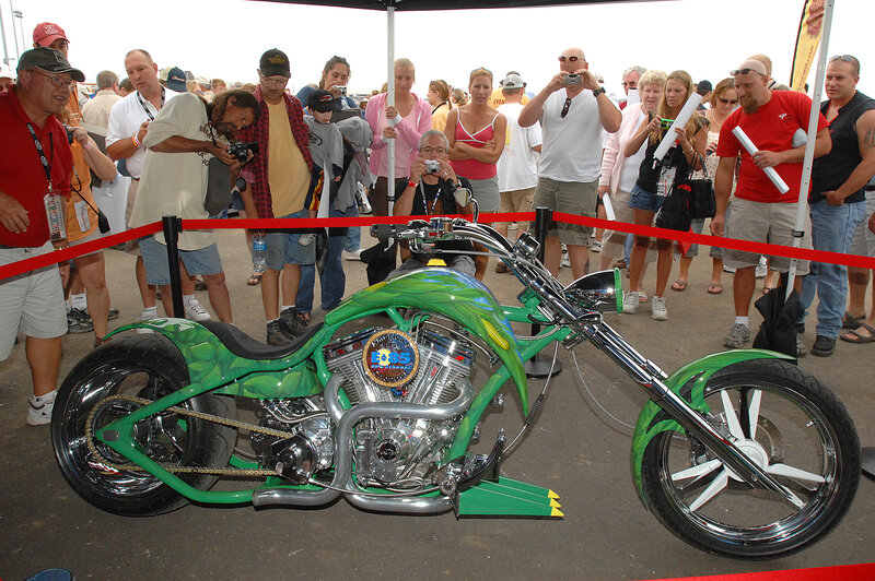 Custom green chopper motorcycle on display