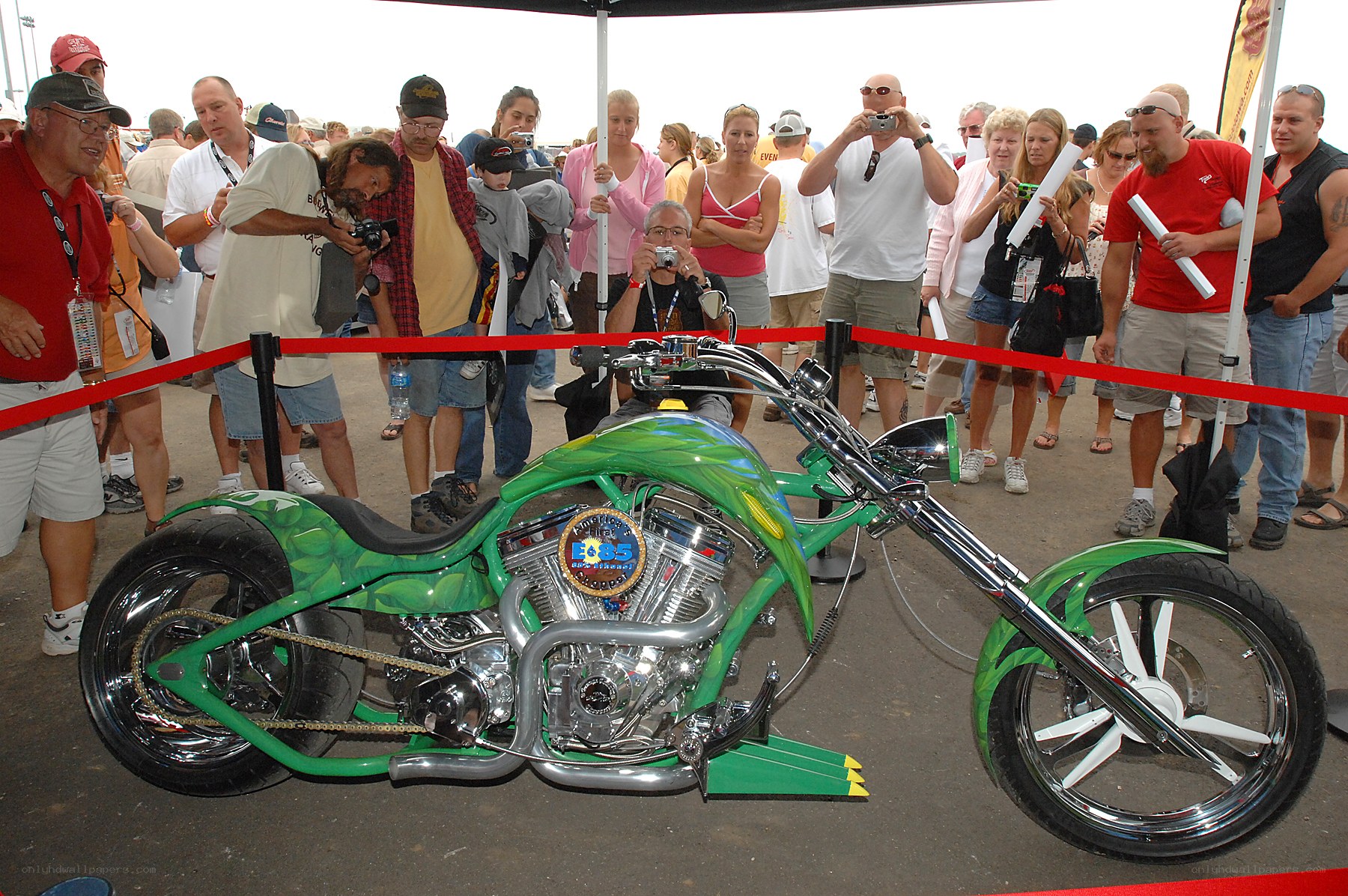 Custom green chopper motorcycle on display