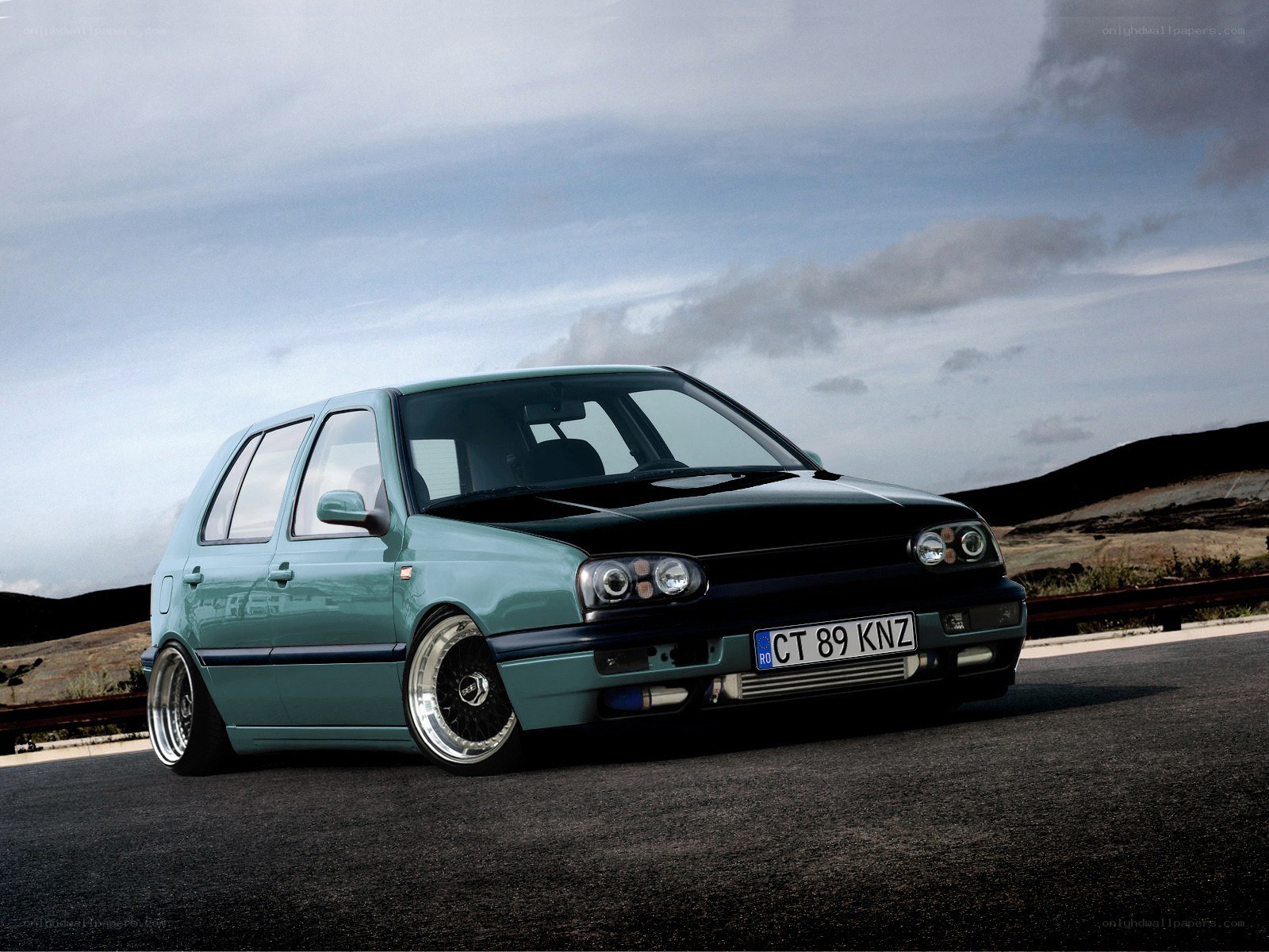 custom green hatchback car