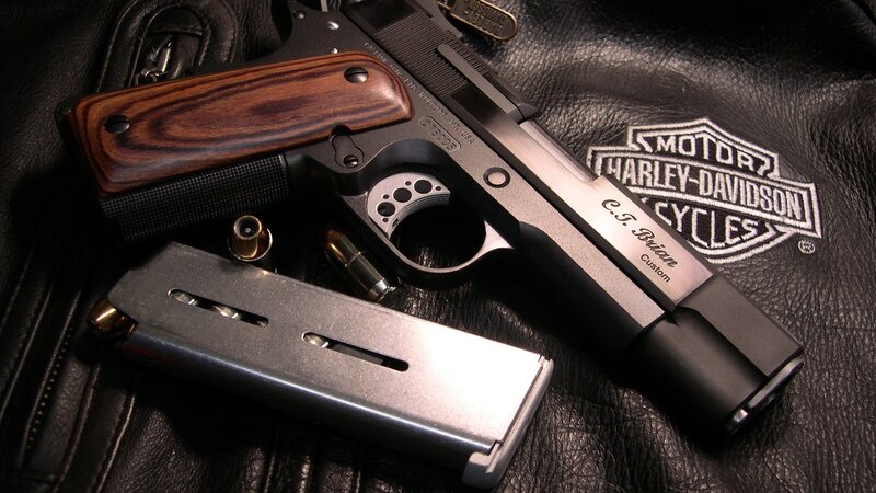 Custom handgun on leather jacket