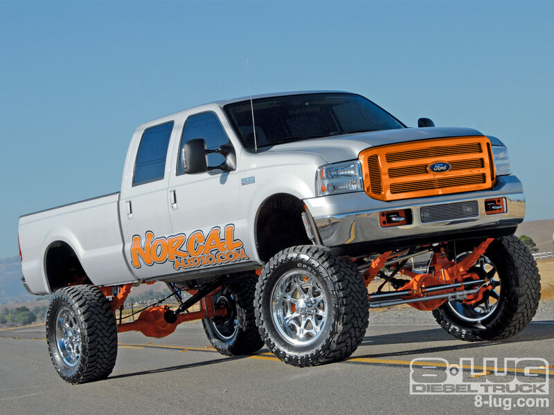 custom lifted truck with orange accents
