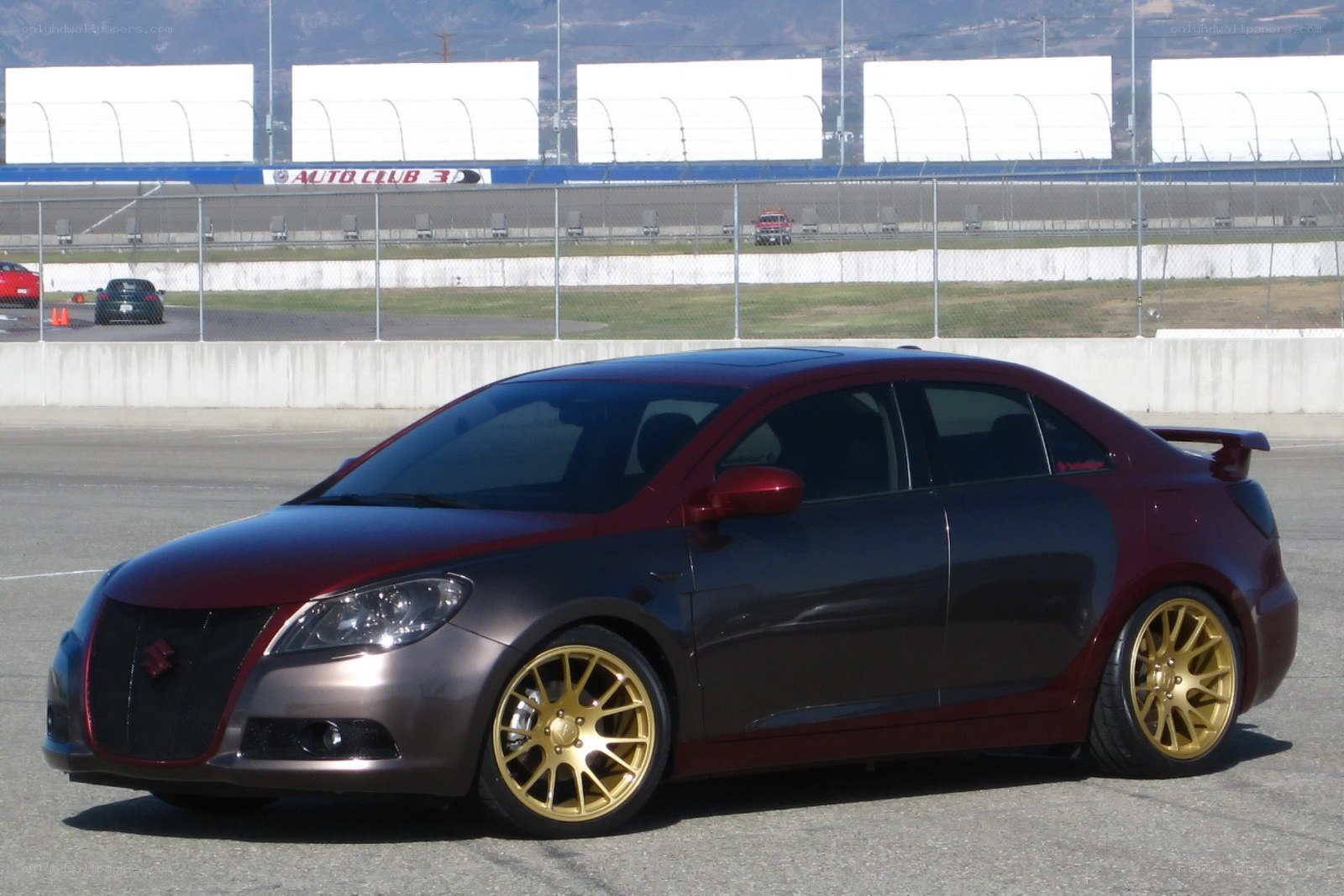 custom maroon and gold sedan