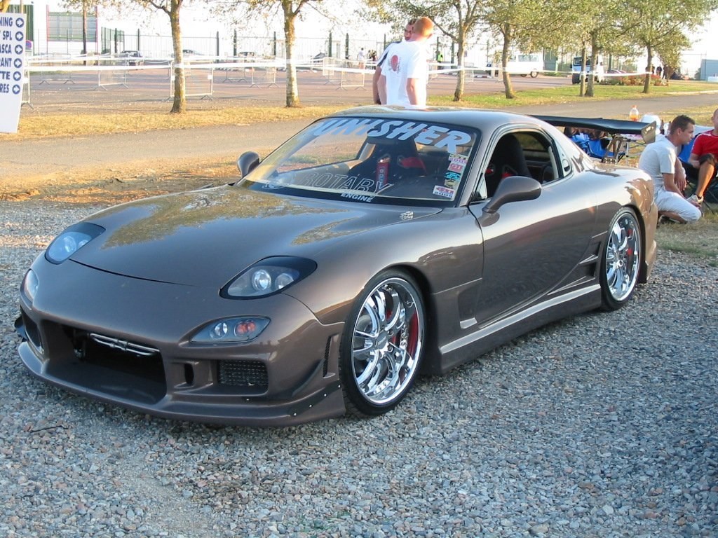 Custom Mazda RX-7 at a car show