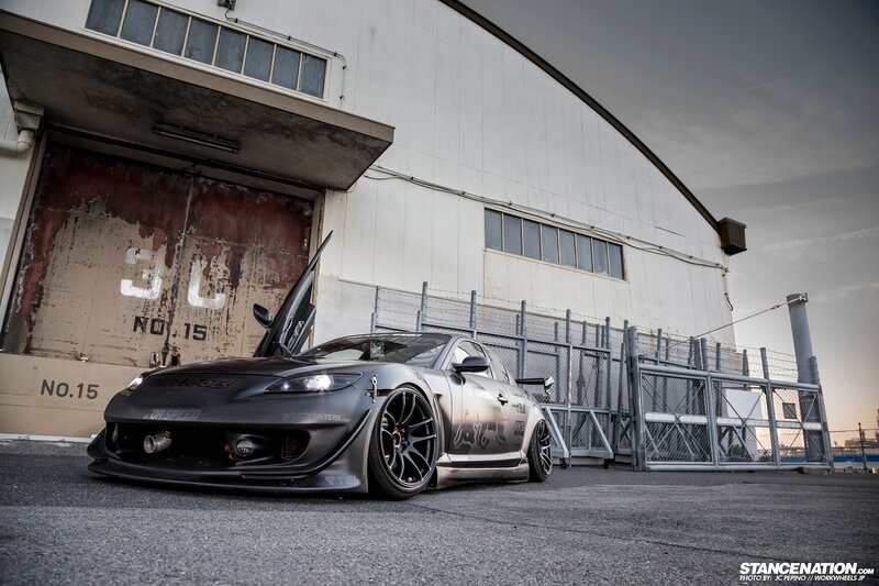 custom mazda rx-8 in front of hangar