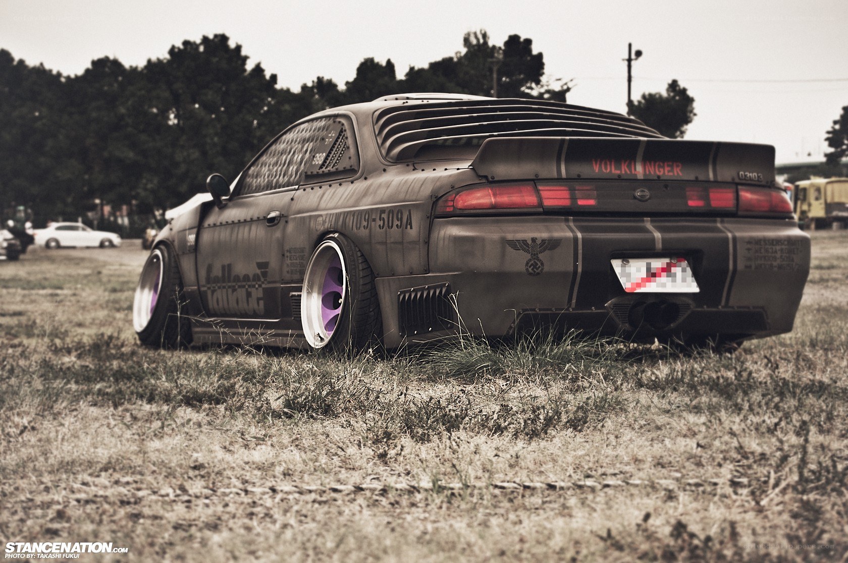 custom modified car in field