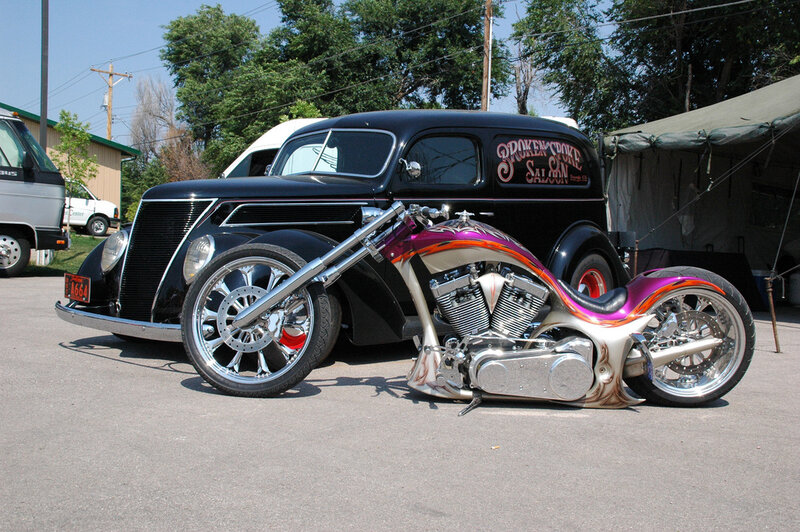 Custom motorcycle and vintage car