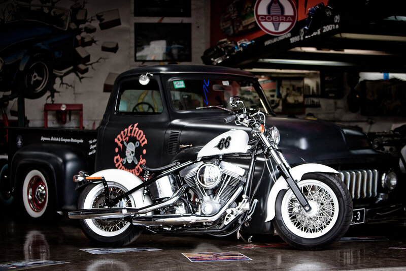Custom Motorcycle in Garage — Black, Dramatic, Photograph