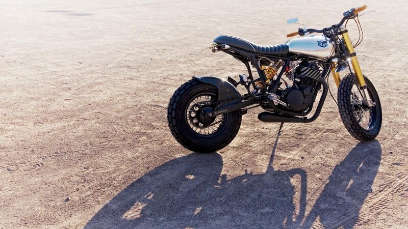 custom motorcycle on desert ground