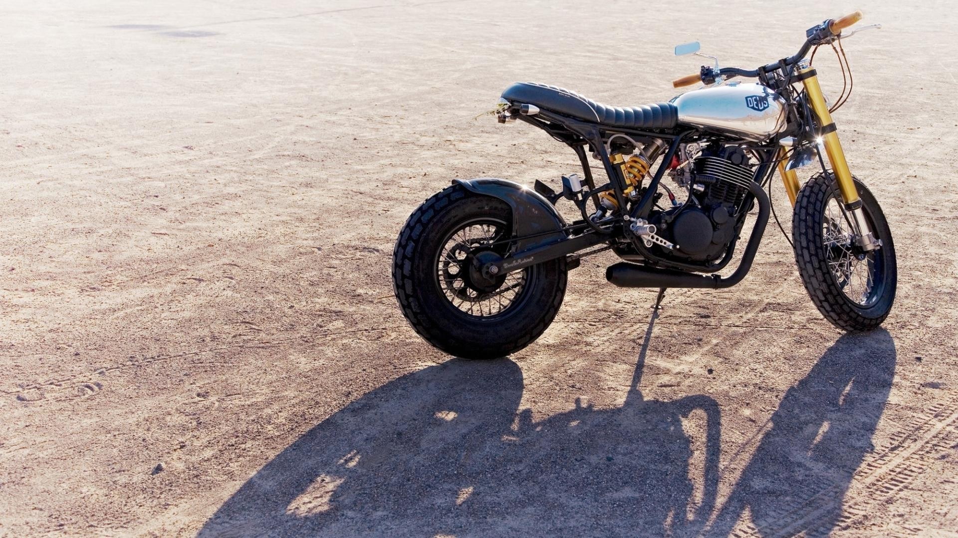 custom motorcycle on desert ground