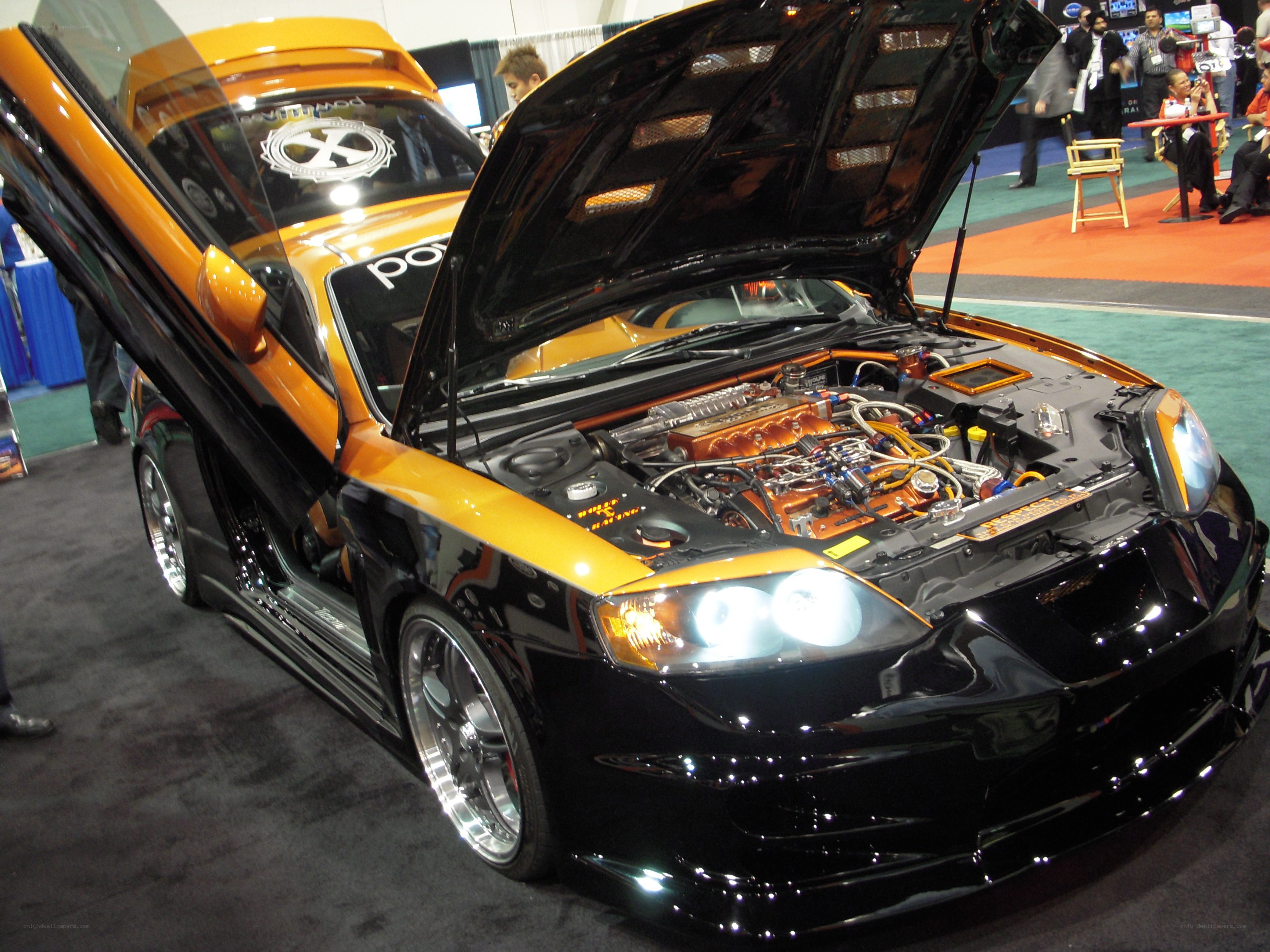 Custom orange and black car on display