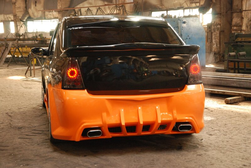 custom orange car in workshop
