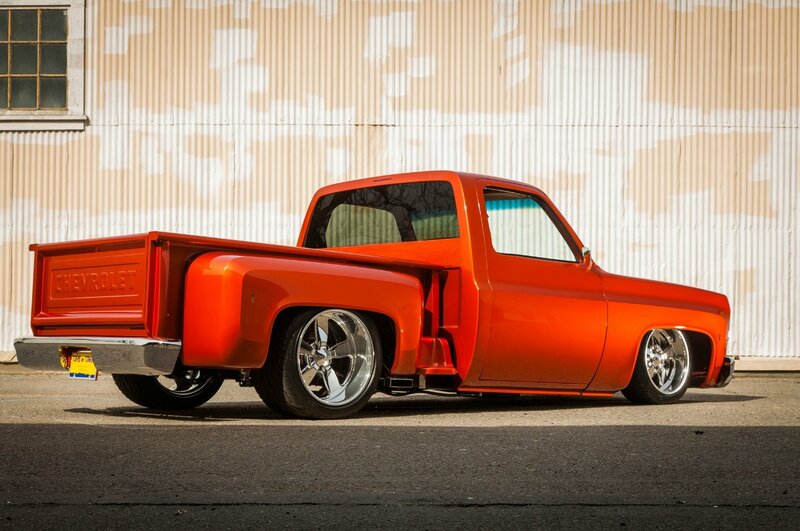 Custom Orange Pickup Truck — Dramatic, Afternoon, Photograph, Building