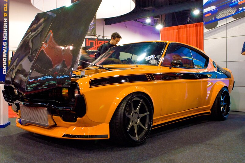 Custom orange sports car on display