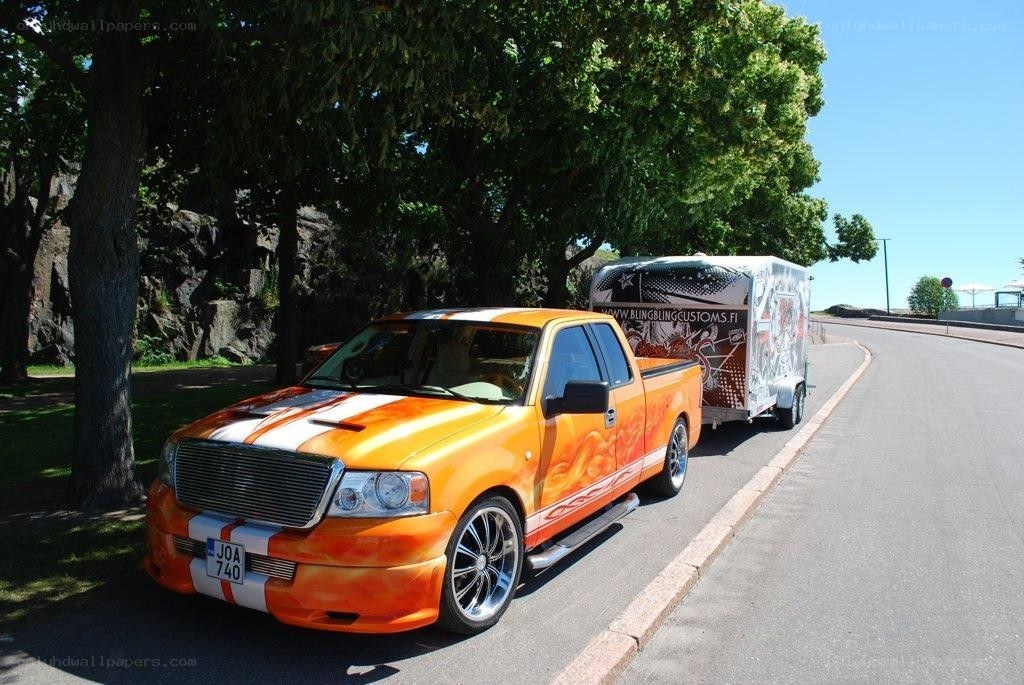Custom orange truck with trailer
