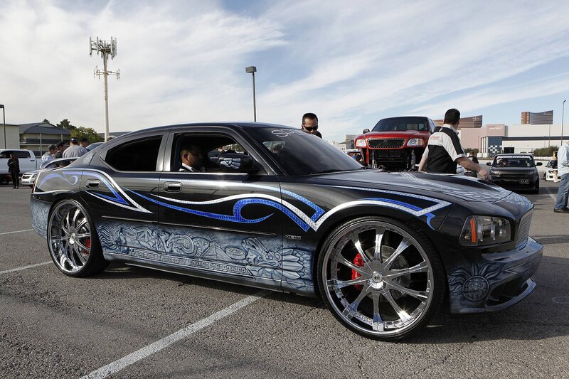 Custom-painted black car at a show