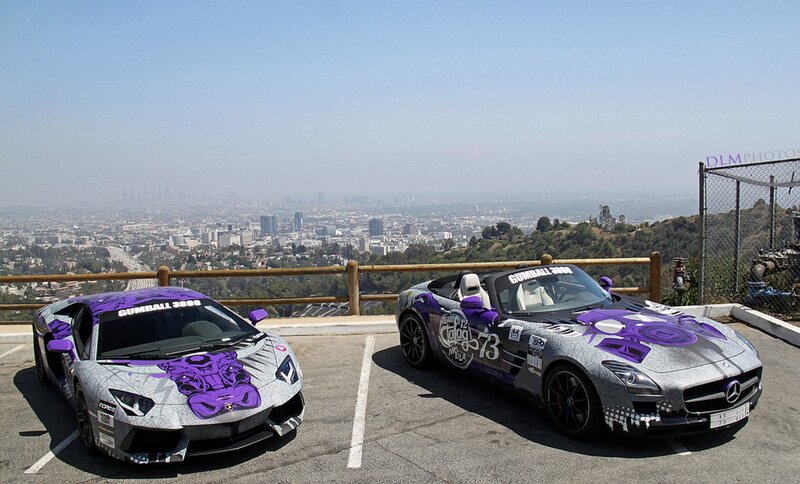 Custom-painted sports cars on a hill
