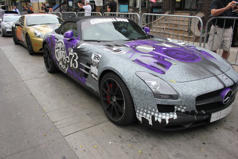 Custom-painted sports cars on display
