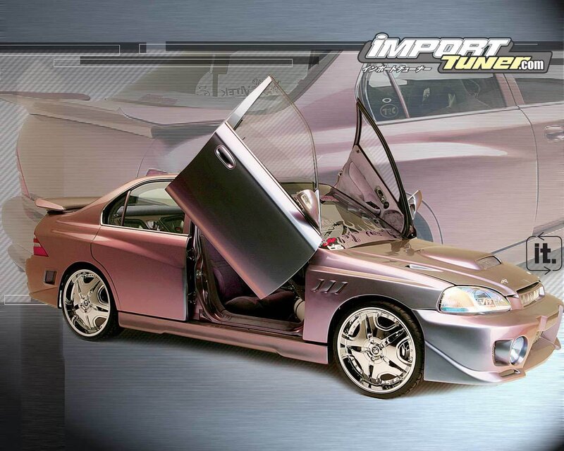 custom pink sedan with gullwing doors