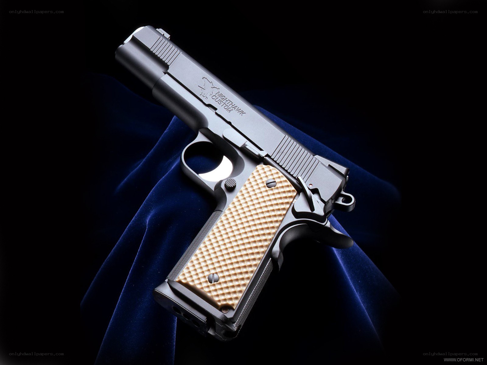 custom pistol on blue cloth