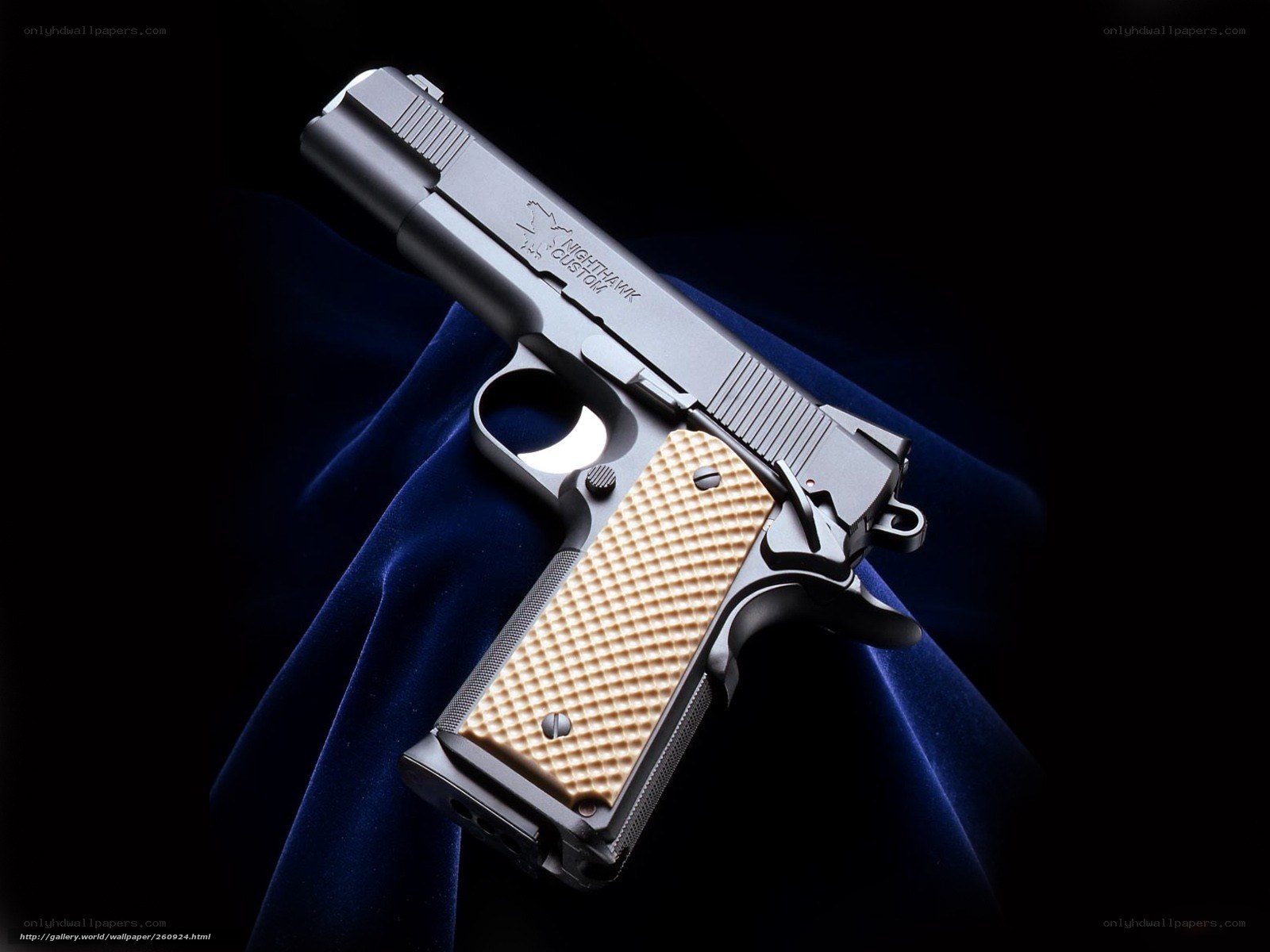 custom pistol on blue cloth