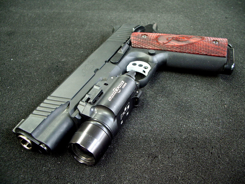 custom pistol with flashlight