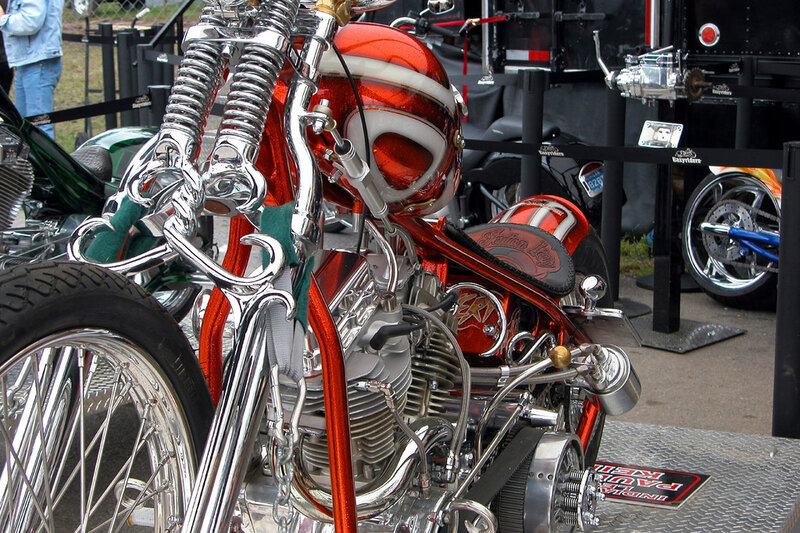 Custom red motorcycle on display