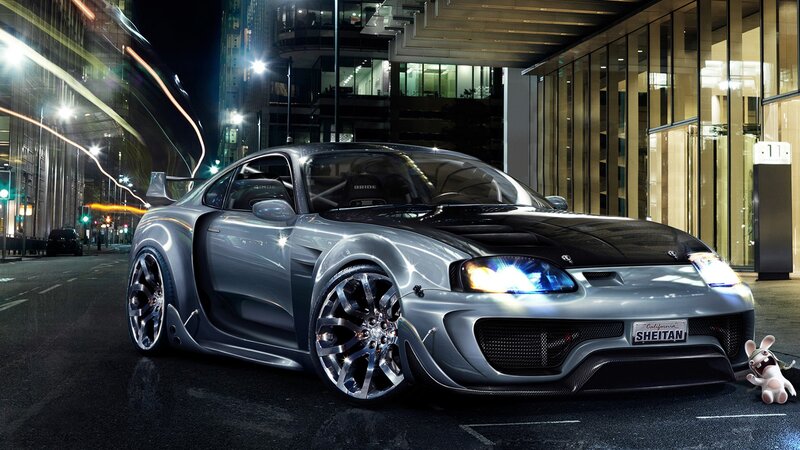 Custom silver sports car at night