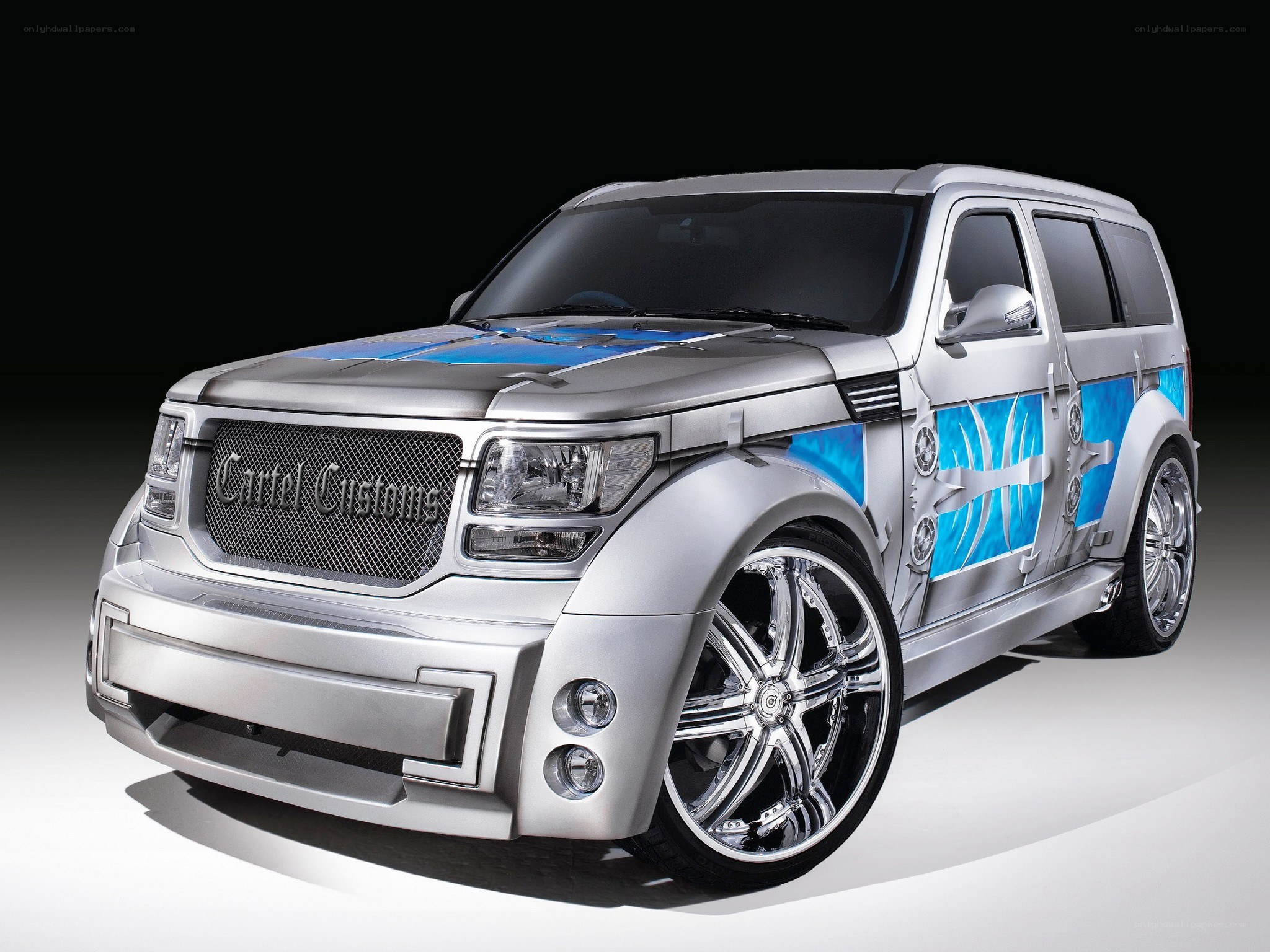 custom silver suv with blue graphics
