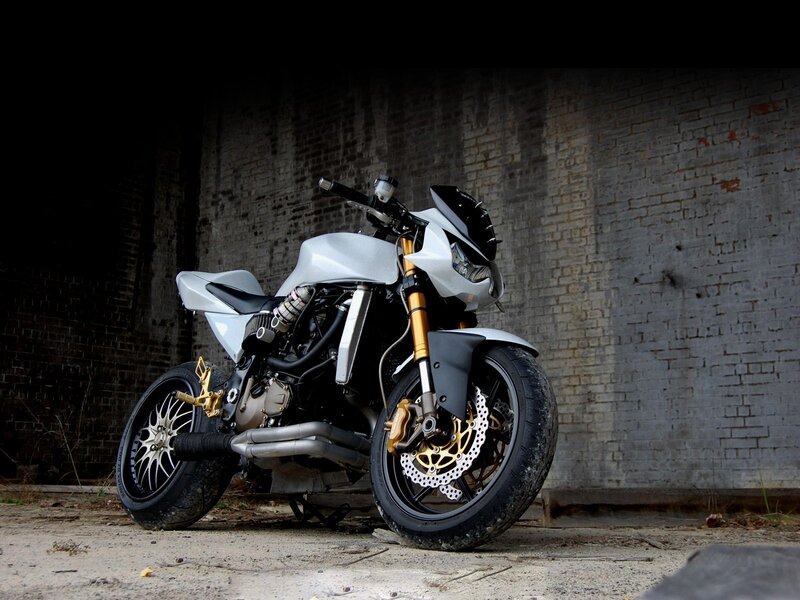 Custom white motorcycle in alley