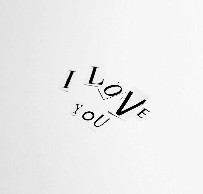 Cut-out Letters on White Surface