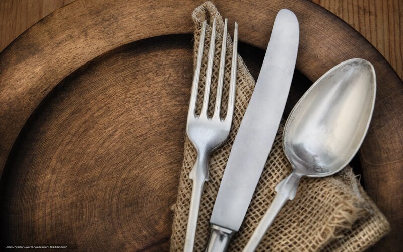 Cutlery on wooden plate