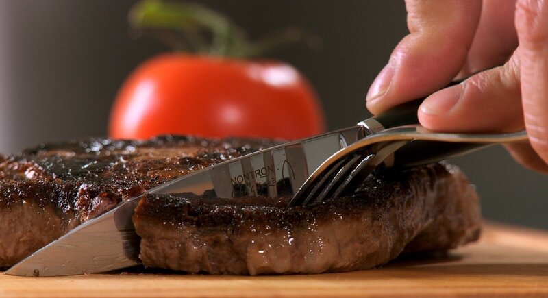 Cutting a grilled steak