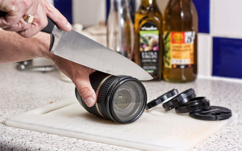 Cutting camera lens with knife