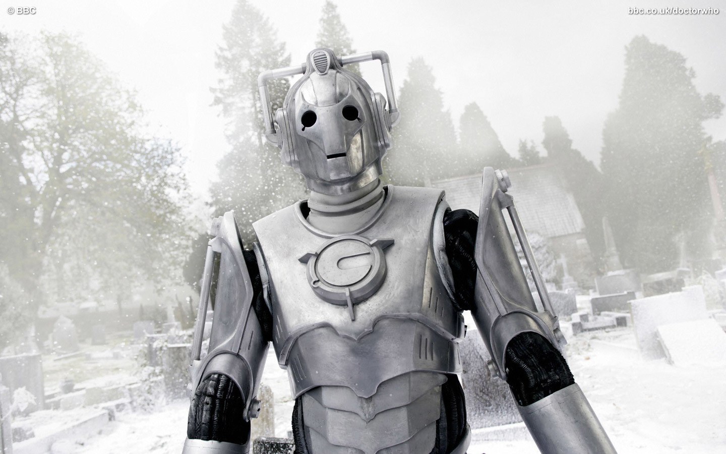 Cyberman in snowy graveyard