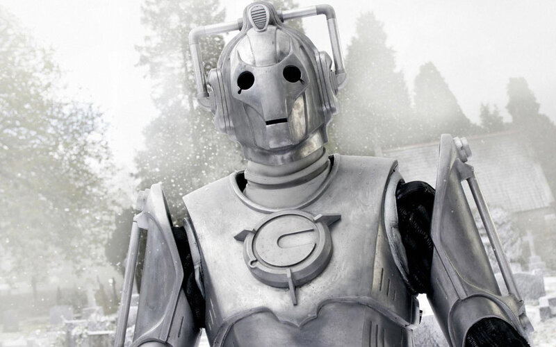 Cyberman in snowy graveyard