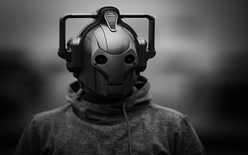 cybernetic figure in hoodie