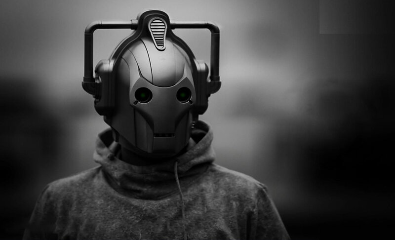 cybernetic figure in hoodie