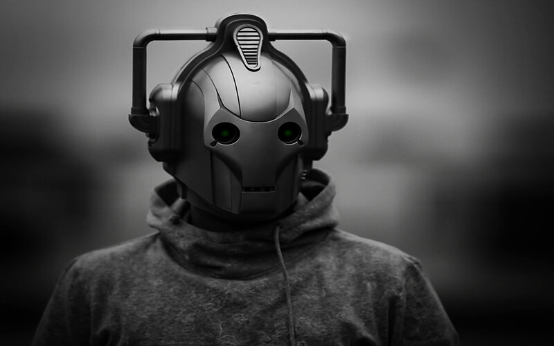 cybernetic figure in hoodie