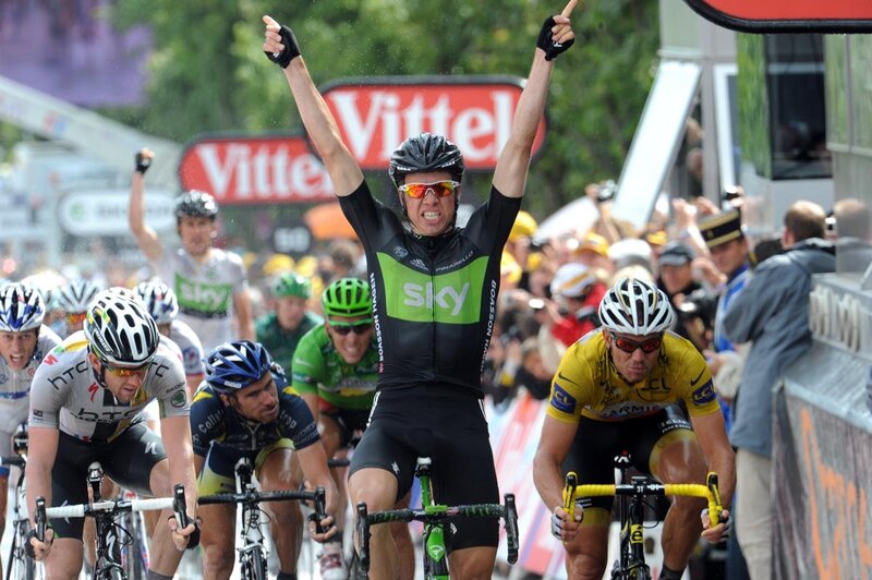 Cyclist celebrates victory at finish line