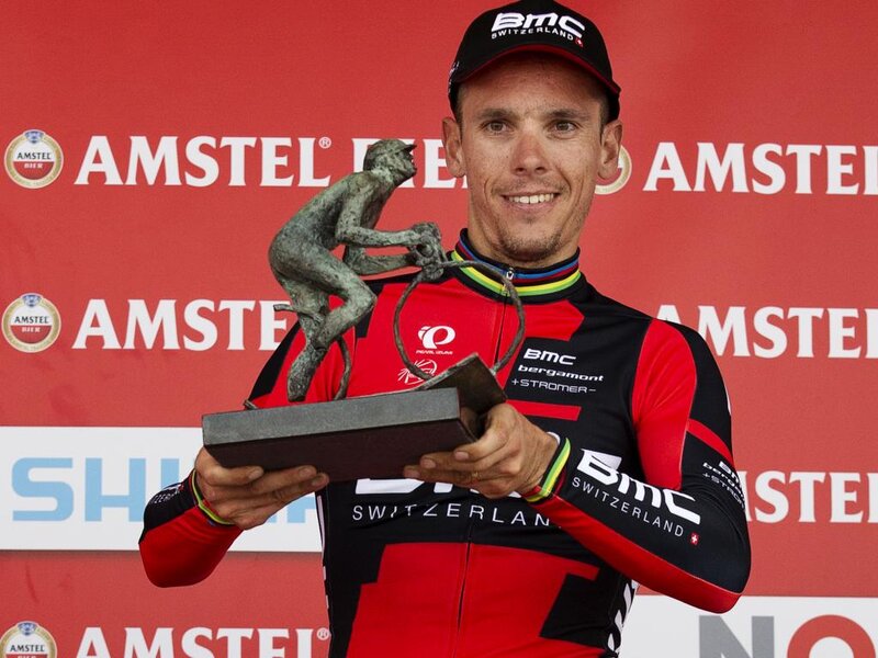 Cyclist Holding Trophy